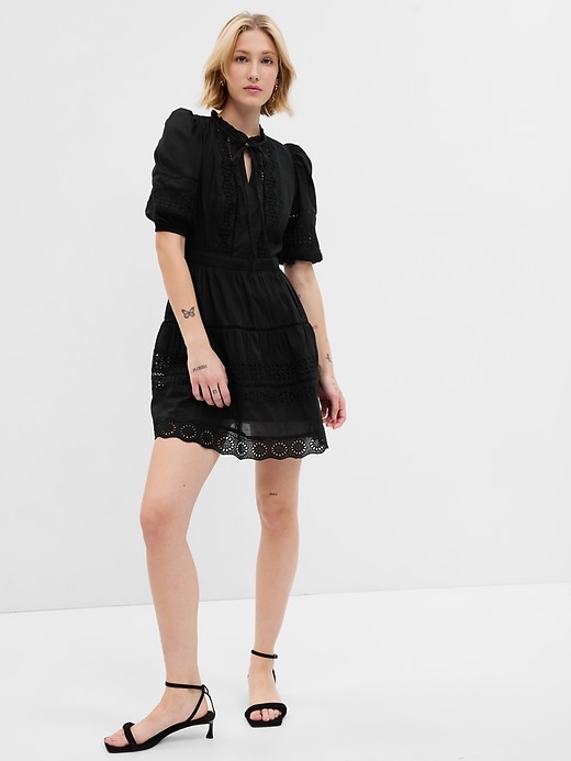 1 of 8 showing, with the color black of product Puff Sleeve Lace Mini Dress