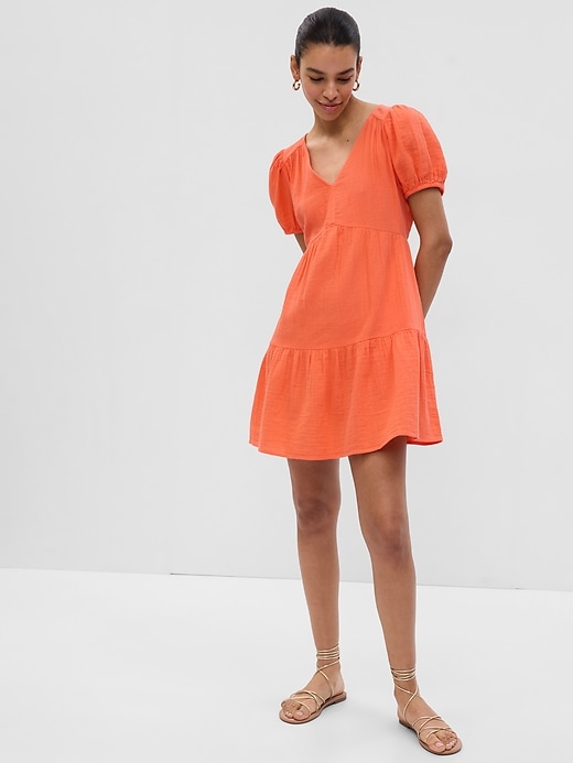 1 of 8 showing, with the color orange coral of product Crinkle Gauze Puff Sleeve Tiered Mini Dress
