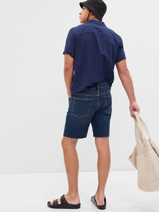2 of 8 showing, with the color dark wash of product 8" Denim Shorts in GapFlex