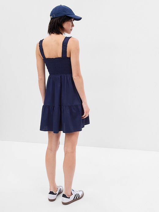 2 of 8 showing, with the color navy blue of product Smocked Tiered Mini Dress