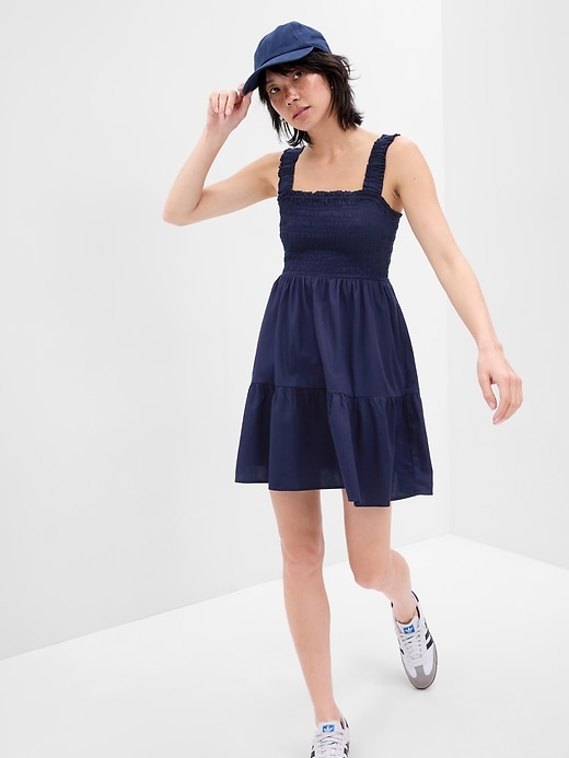 1 of 8 showing, with the color navy blue of product Smocked Tiered Mini Dress