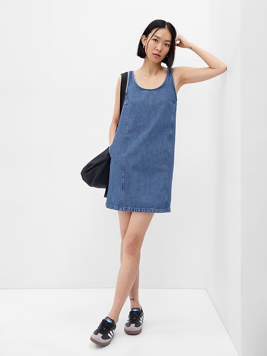 1 of 8 showing, with the color medium wash of product A-Line Denim Mini Dress