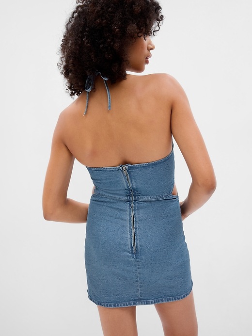 2 of 8 showing, with the color medium wash of product Denim Cutout Halter Mini Dress