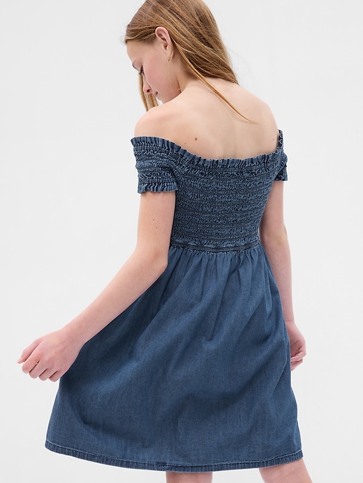 2 of 8 showing, with the color medium wash of product Kids Smocked Denim Dress