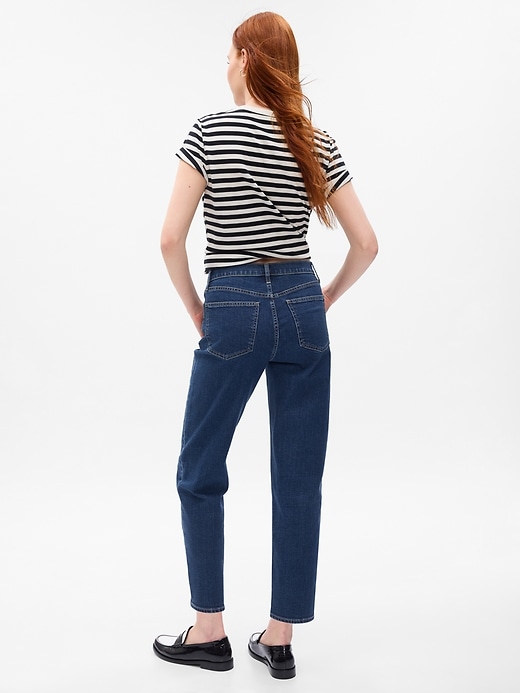 2 of 8 showing, with the color medium indigo of product High Rise Taper Jeans