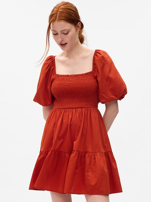1 of 8 showing, with the color cornucopia red of product Puff Sleeve Smocked Mini Dress