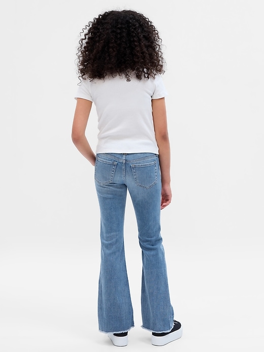 2 of 8 showing, with the color medium wash of product Kids Low Rise Flare Jeans