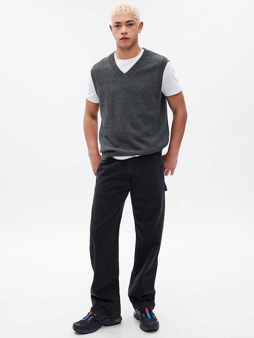 man wearing greay heather v-neck textured sweater vest