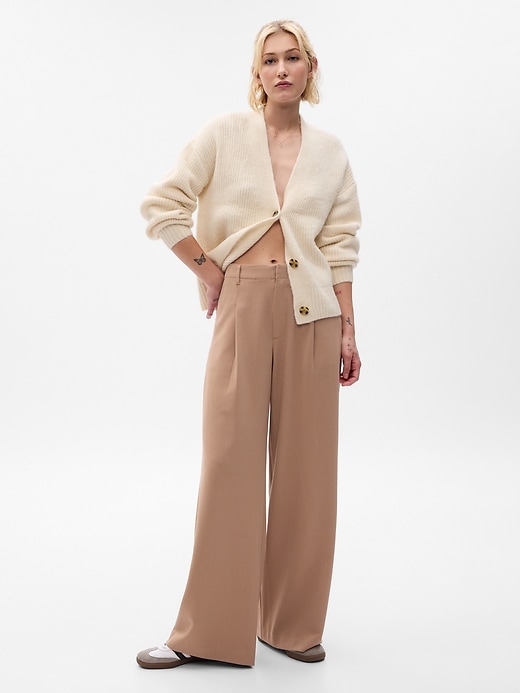 1 of 8 showing, with the color camel hair tan of product High Rise Pleated Wide-Leg Trousers