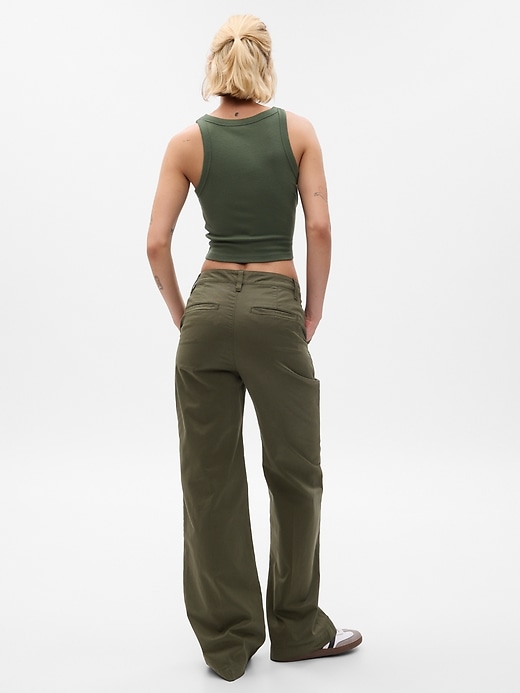 2 of 8 showing, with the color deep green of product High Rise Flare Khakis