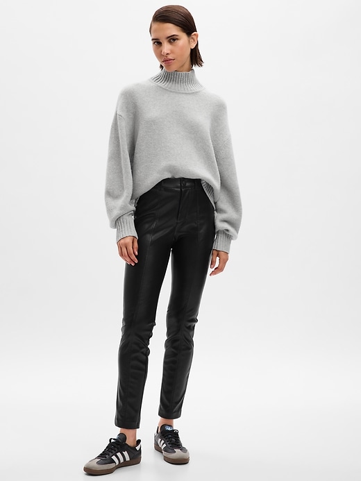 1 of 8 showing, with the color black of product Mid Rise Vegan Leather Skinny Pants