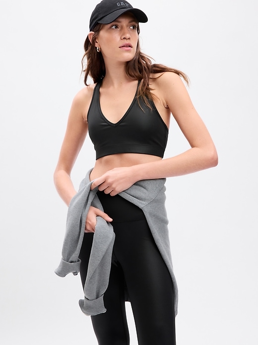 1 of 8 showing, with the color black faux leather of product GapFit Power Low Impact Sports Bra