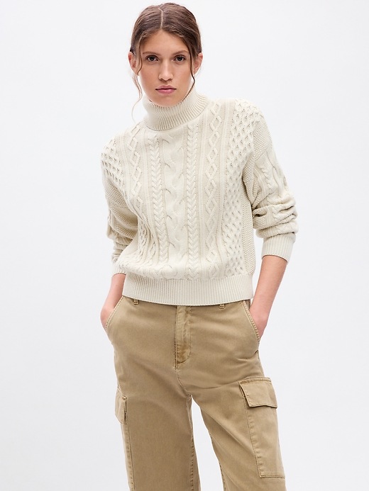 1 of 8 showing, with the color chino beige of product Turtleneck Cable-Knit Cropped Sweater