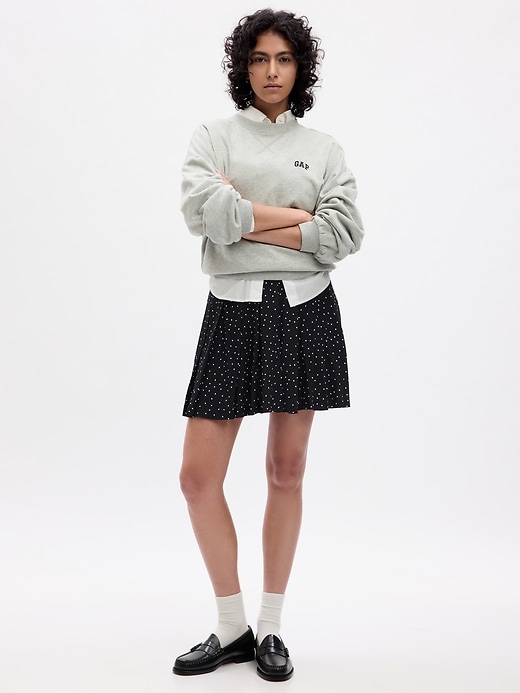 1 of 8 showing, with the color black with white polka dots of product Pleated Mini Skirt