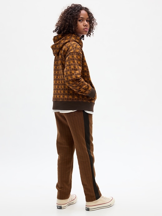 2 of 8 showing, with the color brown of product GAP × DAP Kids Logo Track Pants