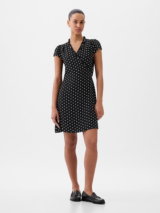 1 of 8 showing, with the color black with white dots of product Wrap Mini Dress
