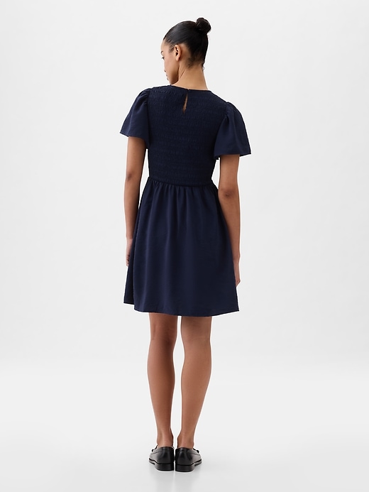 2 of 8 showing, with the color navy blue of product Smocked Mini Dress