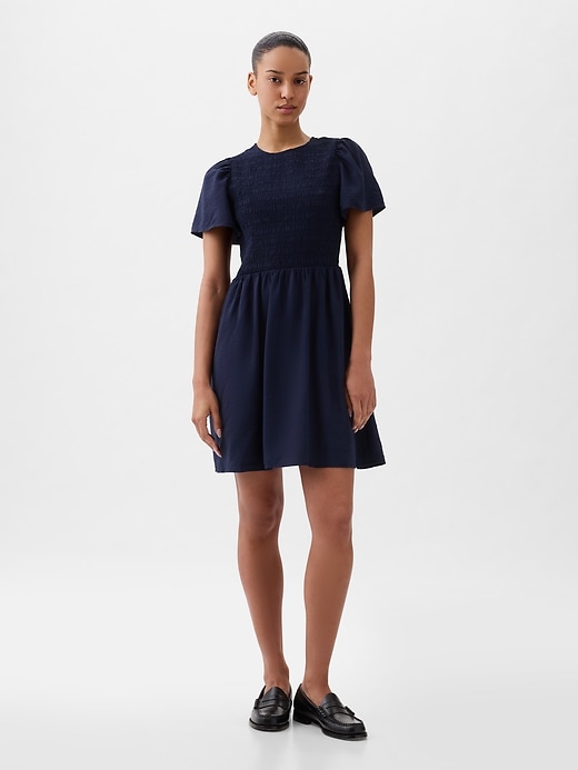 1 of 8 showing, with the color navy blue of product Smocked Mini Dress