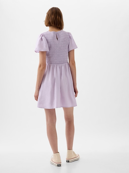 2 of 8 showing, with the color orchid petal purple of product Smocked Mini Dress
