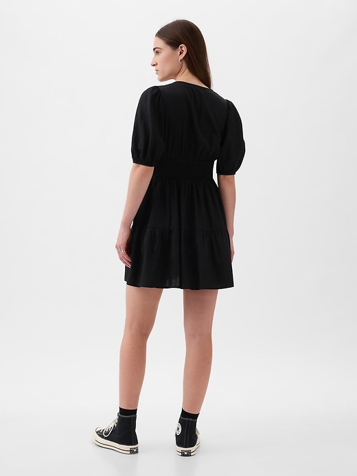 2 of 8 showing, with the color BLACK of product Puff-Sleeve Smocked Mini Dress