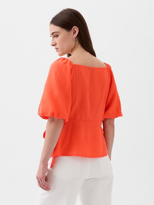 2 of 8 showing, with the color blood orange of product Linen-Blend Wrap Top