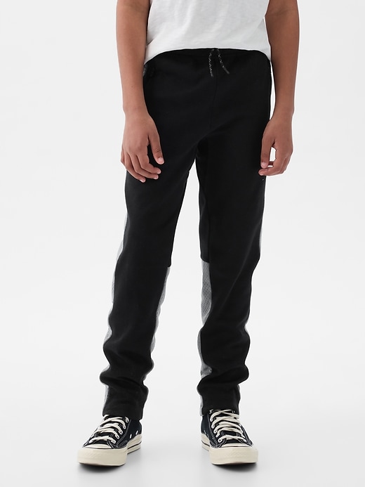 1 of 8 showing, with the color black colorblock of product GapFit Kids Fit Tech Pants