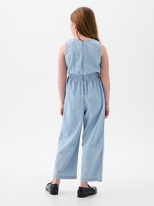 2 of 8 showing, with the color medium wash of product Kids Denim Cutout Jumpsuit