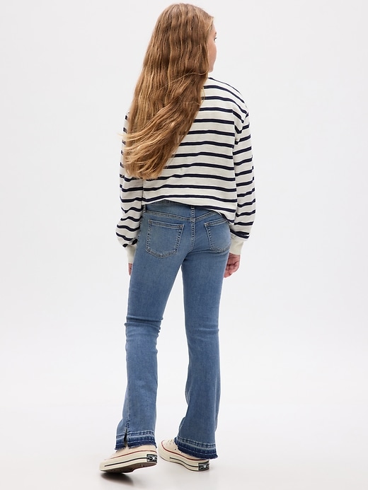 2 of 8 showing, with the color medium wash of product Kids Low Rise Boot Jeans