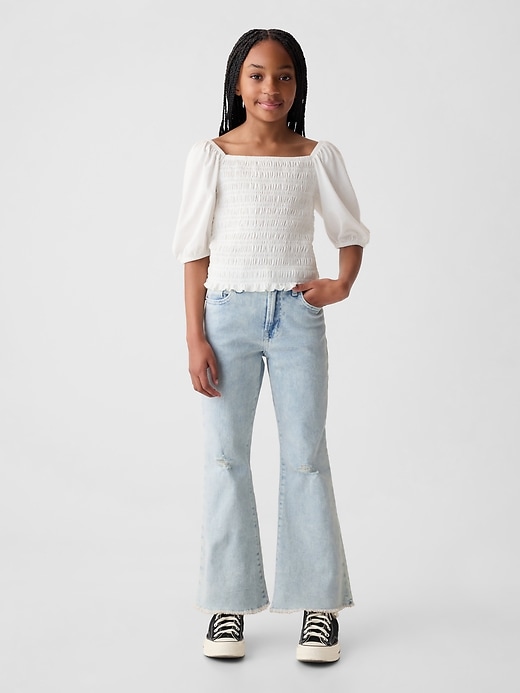 1 of 8 showing, with the color medium wash of product Kids High Rise '70s Flare Ankle Jeans