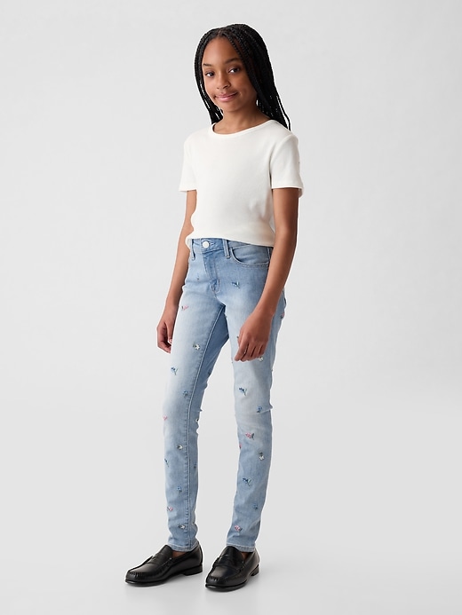 1 of 8 showing, with the color medium wash of product Kids Mid Rise Embroidered Skinny Jeans