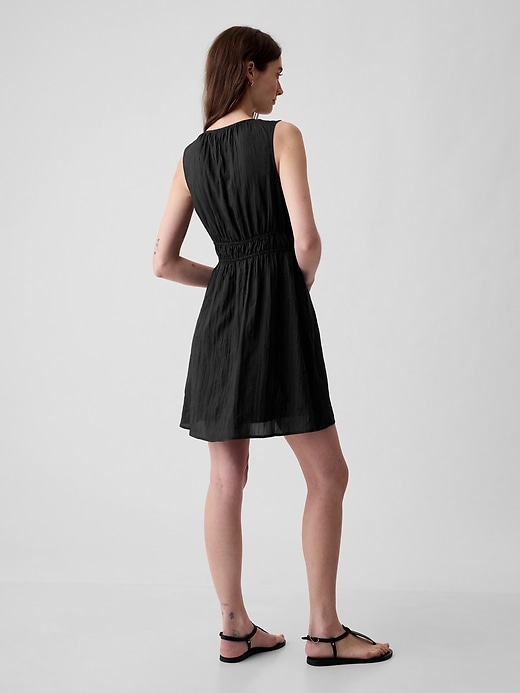 2 of 8 showing, with the color black of product Textured Crinkle Empire Waist Mini Dress