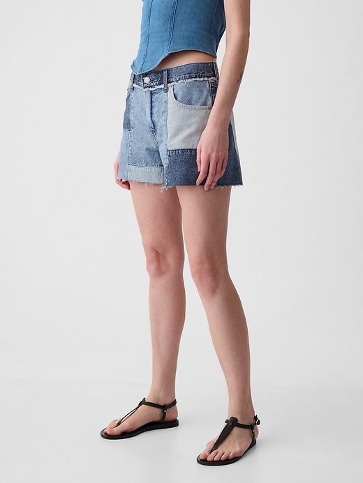 2 of 8 showing, with the color medium indigo of product 4" Low Rise Stride Patchwork Denim Shorts