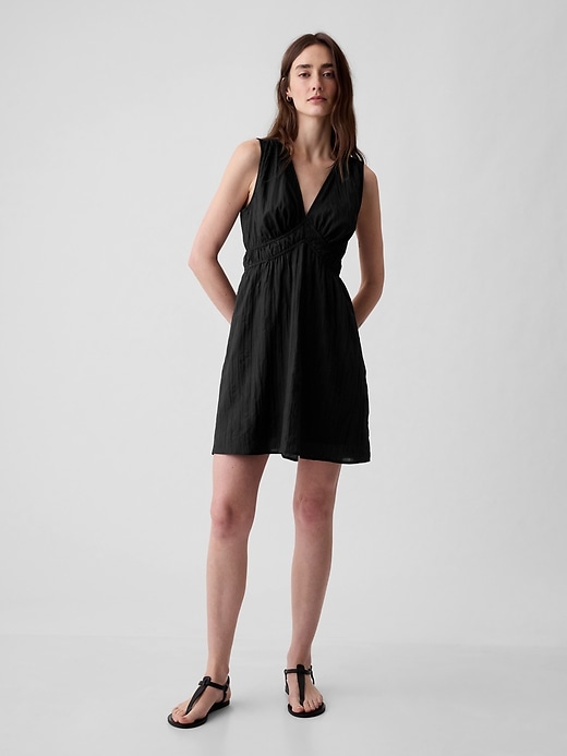 Image number 1 showing, Textured Crinkle Empire Waist Mini Dress