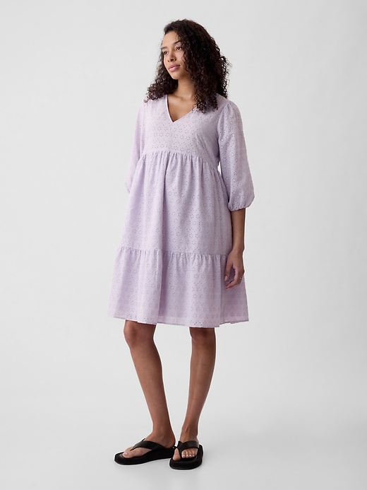 1 of 8 showing, with the color orchid petal purple of product Maternity Eyelet Tiered Mini Dress