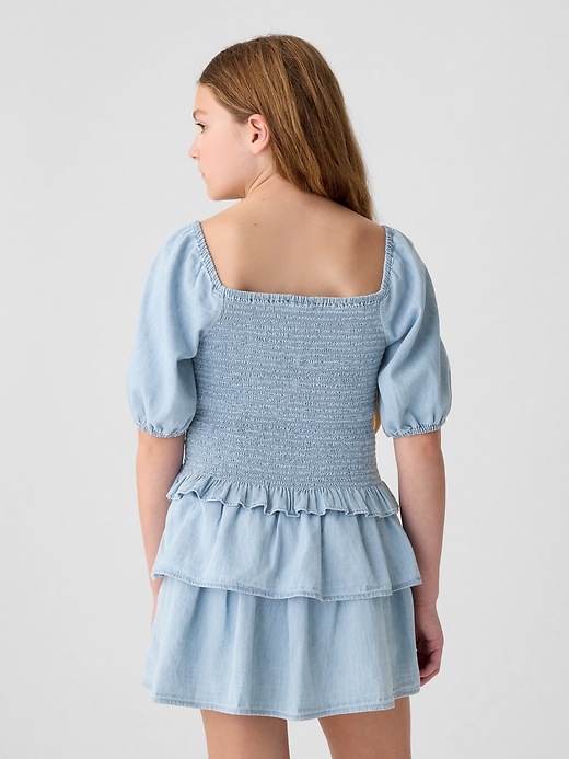 2 of 8 showing, with the color medium wash of product Kids Smocked Denim Top