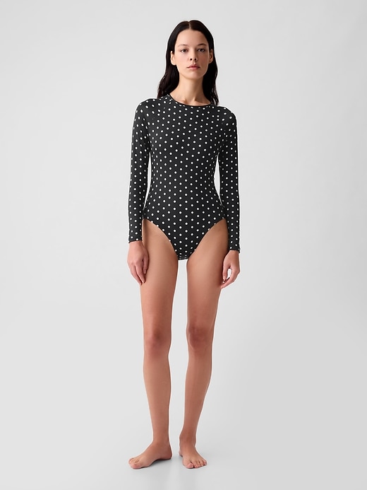 1 of 8 showing, with the color black with white polka dots of product Rash Guard One-Piece Swimsuit