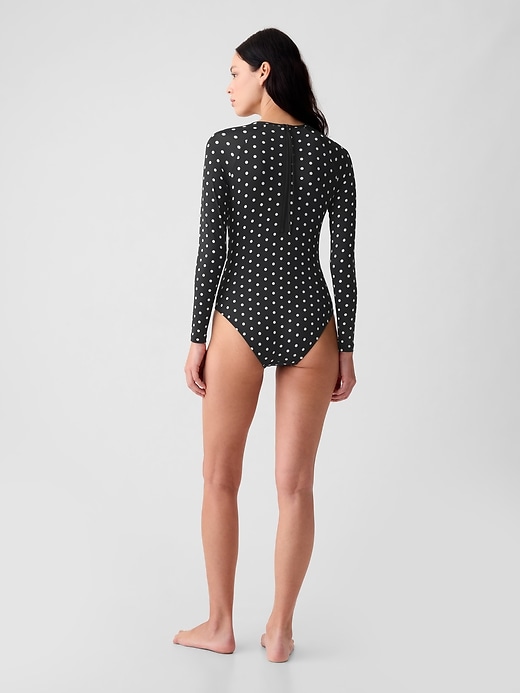 2 of 8 showing, with the color black with white polka dots of product Rash Guard One-Piece Swimsuit