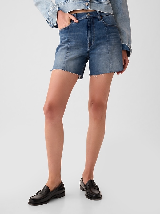 2 of 8 showing, with the color medium indigo of product 4" High Rise Girlfriend Denim Shorts