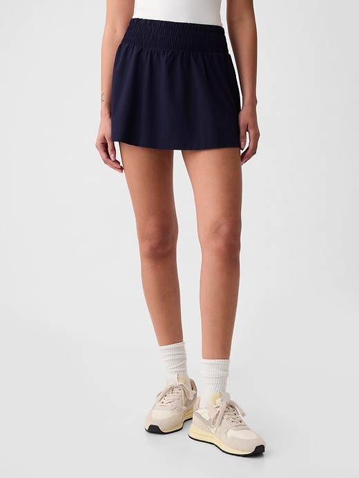 1 of 8 showing, with the color navy blue of product GapFit Sky High Rise Runaround Exercise Skort
