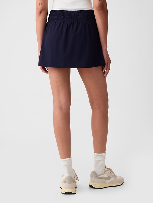 2 of 8 showing, with the color navy blue of product GapFit Sky High Rise Runaround Exercise Skort