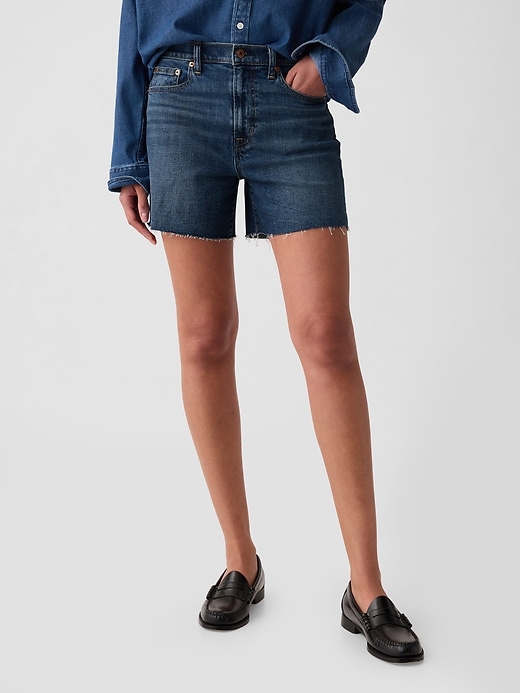 2 of 8 showing, with the color dark indigo of product 4" High Rise Girlfriend Denim Shorts