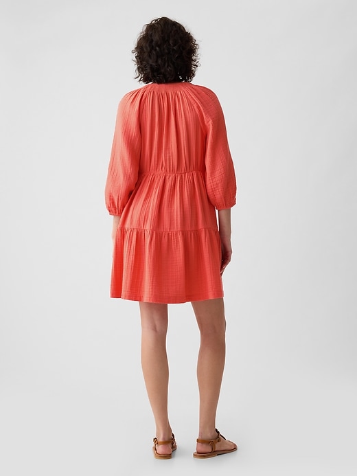 2 of 8 showing, with the color fire coral red of product Crinkle Gauze Tiered Mini Dress