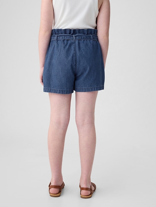 2 of 8 showing, with the color medium wash of product Kids High Rise Paperbag Denim Shorts