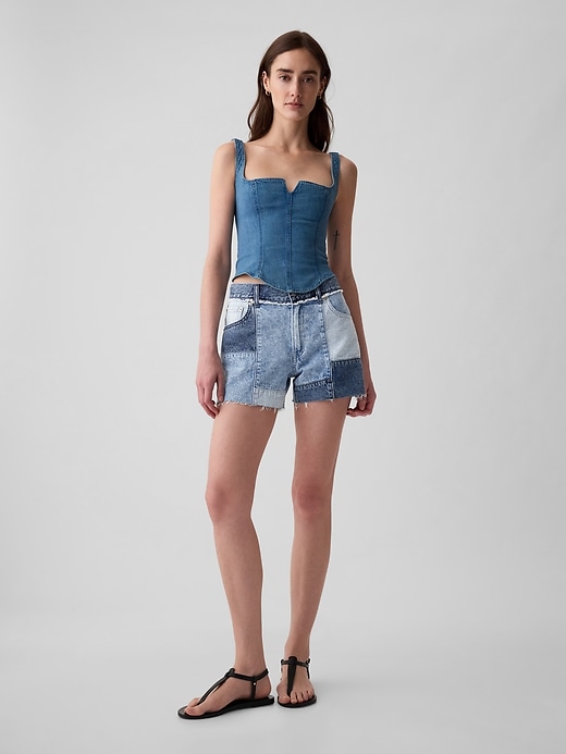 1 of 8 showing, with the color medium indigo of product 4" Low Rise Stride Patchwork Denim Shorts