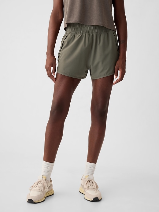 1 of 8 showing, with the color greenish grey of product GapFit High Rise Running Shorts