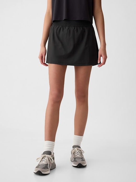 1 of 8 showing, with the color True black of product GapFit Sky High Rise Runaround Exercise Skort