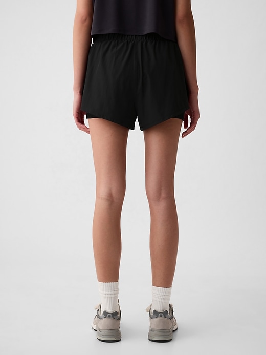 2 of 8 showing, with the color true black of product GapFit Mid Rise Dolphin Running Shorts