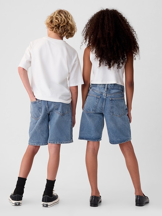2 of 8 showing, with the color medium wash of product Kids '90s Loose Denim Shorts