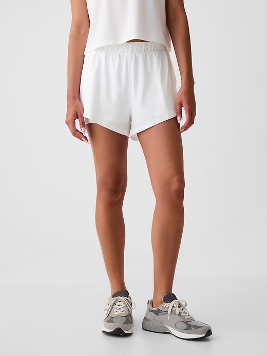 1 of 8 showing, with the color Optic white of product GapFit Mid Rise Dolphin Running Shorts