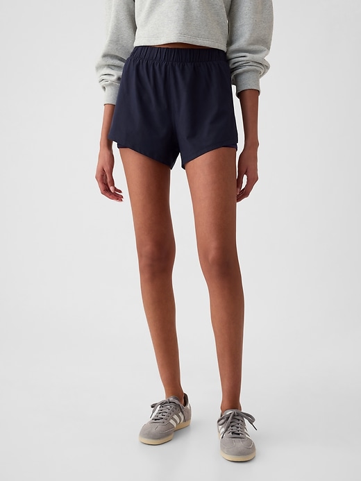 Image number 1 showing, GapFit Mid Rise Dolphin Running Shorts